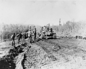 African American engineers operating a 23 ton bulldozer making the Alaska Highway. 1942