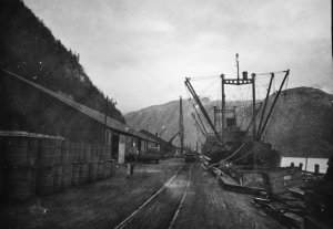 Skagway Harbor was crowded while ships waited for the 20 foot tide to rise so they could park along the dock. 1942