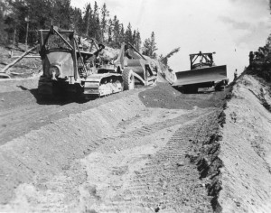 Two dozers grading Alaska Highway 52 miles from Carcross heading toward Johnsons Crossing. 1942