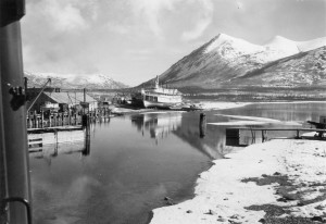 Looking out WP&YT train window at Tutshi Steamboat and Nares Mountain in Carcross, YT. 1942