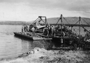 73rd Pontoon Company attached to the 93rd Black Engineers built a pontoon ferry to transport equipment across the Tagish River. 1942
