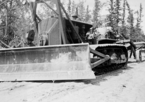 A new Alaska Highway D8 dozer ready for a checkup at the 93rd Engineers Jakes Corner Motorpool. 1942