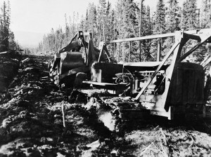 A Black soldier operated his D8 dozer, grinding it through the mud, but it became mired in knee deep muck. 1942