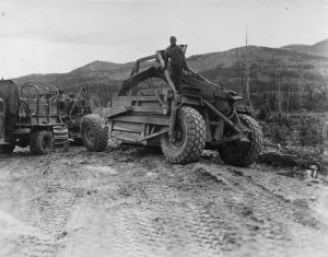 Portable 93rd lube trailer on Alaska Highway providing maintenance. 1942