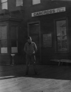 Lt. Turner G. Timberlake of H&S Company, 93rd Engineers stands in front of Carcross train depot. 1942