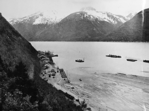 Skagway Harbor with the 20 foot tide out and many ships waiting for the return of the tide to dock. 1942