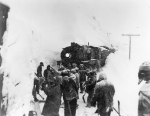 WP&YT locomotive frozen on tracks. Army railroad 770th Battalion is attempting to free her. 1942