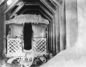 Caboose in cold storage is frosted and parts frozen. Metal on railcars becomes very brittle in the severe cold.1942