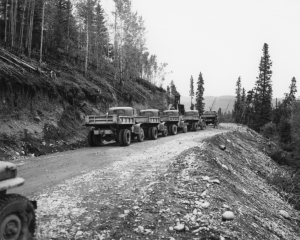 In the Northern Sector of the Alaska Highway, the 428th heavy dump trucks hauled gravel and fill dirt for road surfaces and corduroy layers. 1942