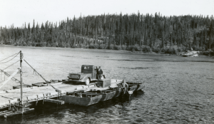 PRA contractor with his truck on Teslin River ferry at Johnsons Crossing. Sept 1942.
