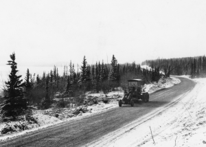 PRA grading Alaska Highway along the shore of Marsh Lake. 1943