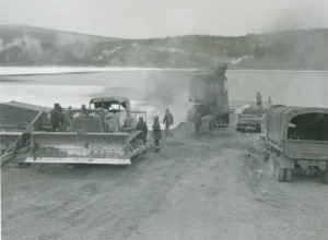93rd Engineers load a Osgood shovel on barge at Nisutlin Bay. Nov 42